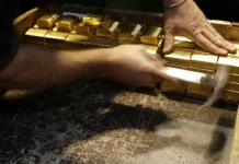 Ouro fecha em queda amenizada no fim da sessão após cancelamento de ataques
